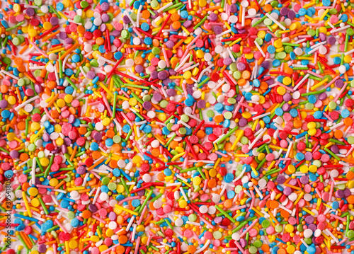 Close up of colorful eatable sugar sprinkles for food decoration. Candy texture. © KsPhoto