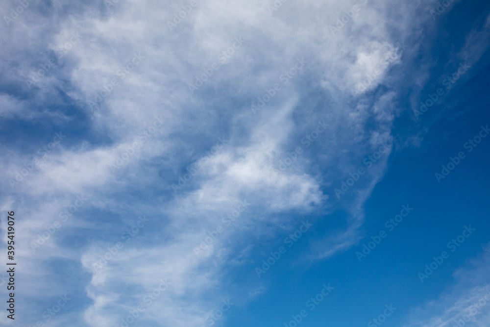 Blue sky with white clouds beautiful background.