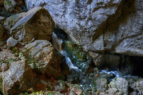 Cave river and waterfall