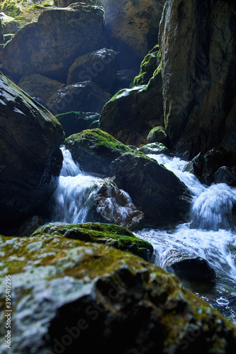 Cave river and waterfall photo