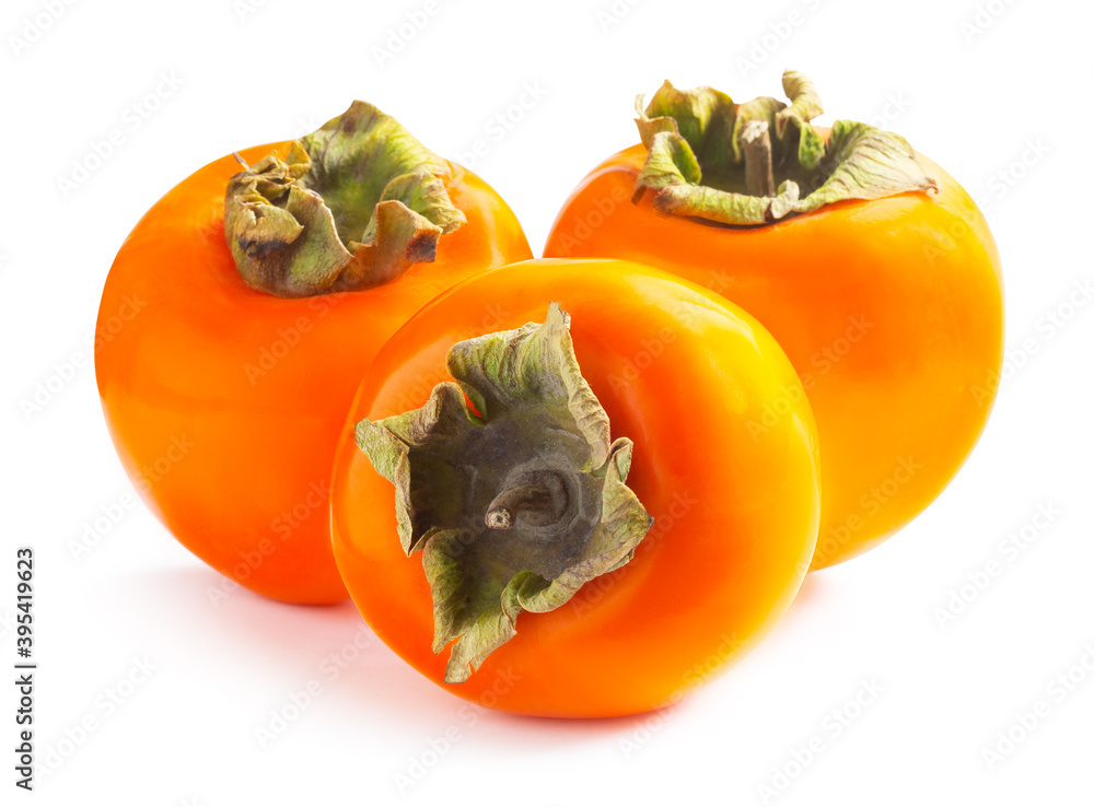 Three ripe persimmons isolated on white background Three ripe persimmons isolated on white background