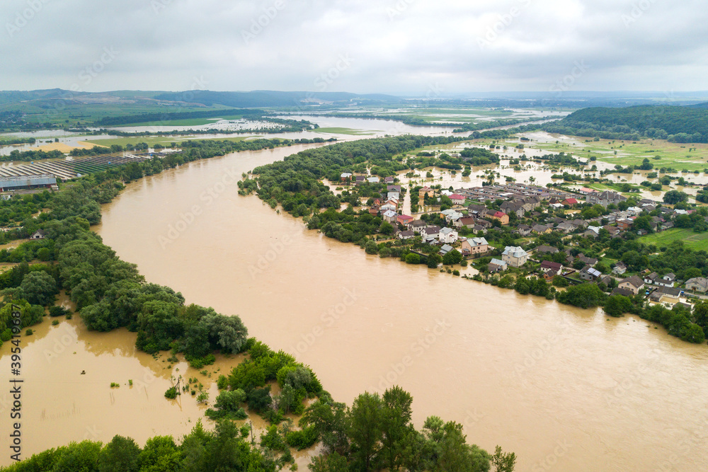 Aerial view of Dnister river with dirty water and  flooded houses in Halych town, western Ukraine.