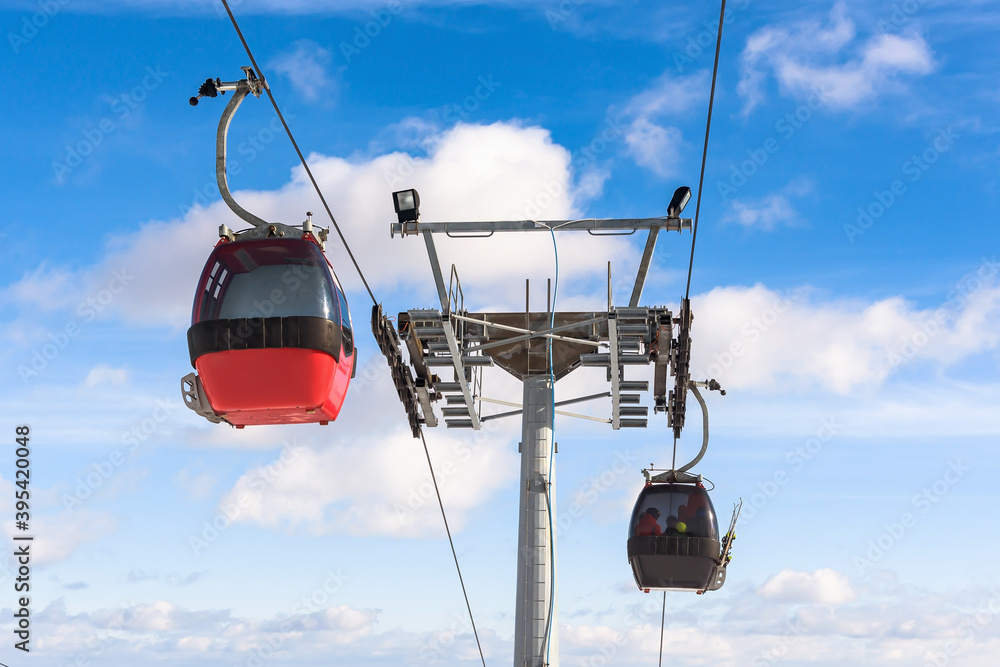 Gondola ski lift against the blue sky Gondola ski lift against the blue sky