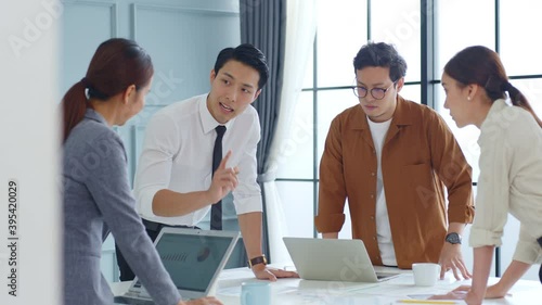 Group of young Asian business people meeting and brainstorming in office