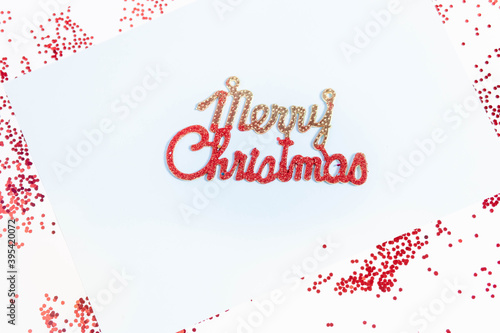Words Merry Christmas on a colored background. Merry Christmas. Merry Christmas on a colored background with decorations.
