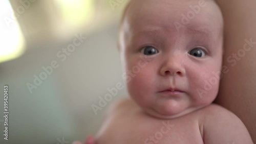 mother tickle baby girl on the living room photo