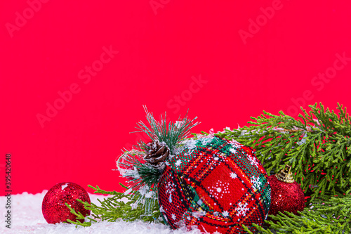 close-up red christmas decorations and snow (ID: 395420648)