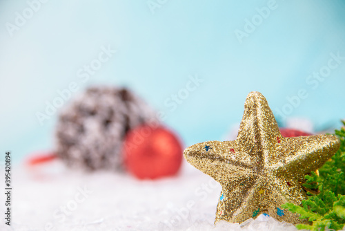 shiny new year star ornament on snowy background for Cristmas
 (ID: 395420894)