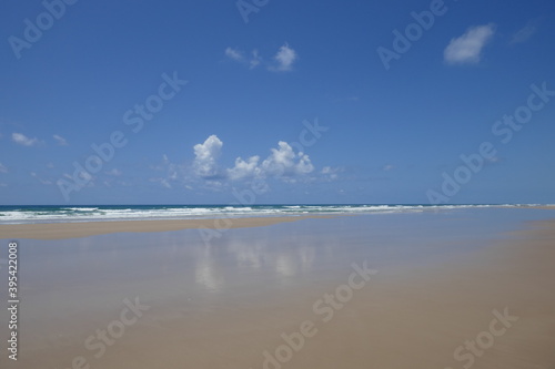 Cloud mirrored in the water at the beach of Itacaré, Bahia, Brazil