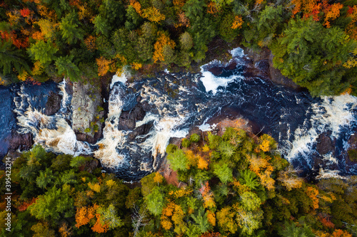 Εκτύπωση καμβά Beautiful look down travel photograph of the upper Potato River Falls waterfall cascades and whitewater rapids cutting through the deciduous and evergreen forest wilderness in Wisconsin