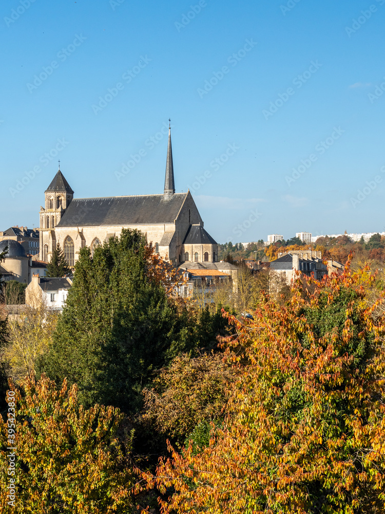 View on a church in the town of poitiers, france. Surrounded by vegetation. Photographed during autumn.