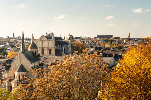 View on the city of Poitiers, in France. Photographed during autumn. View on the roof. There are churchs and cathedral. Sunny day. photo