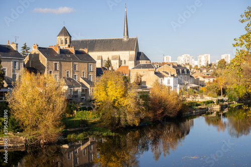 View on the clain river in Poitiers. There is a church. Sunny day, photographed in the autum.