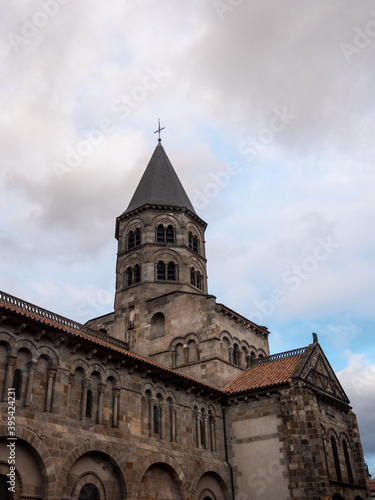Tower of Basilica of Notre-Dame du Port in Clermont-Ferrand  a french city located in Auvergne region. Black stones.