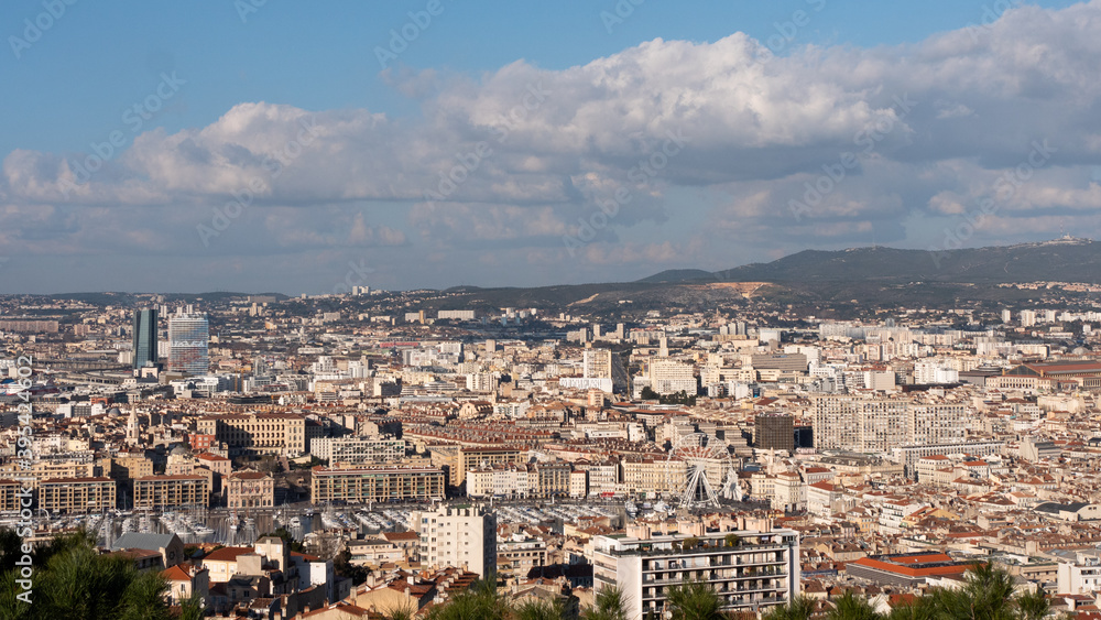Cityscape of Marseille in southern France. Marseille is the prefecture of the department of Bouches-du-Rhône and region of Provence-Alpes-Côte d'Azur in France. Cloudy sky.