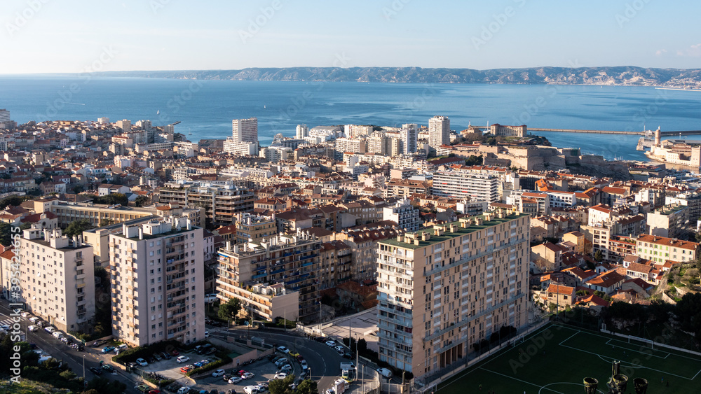 Cityscape of Marseille. View from Notre-Dame de la Garde at the highest natural point in Marseille. Mediterranean sea in the background.