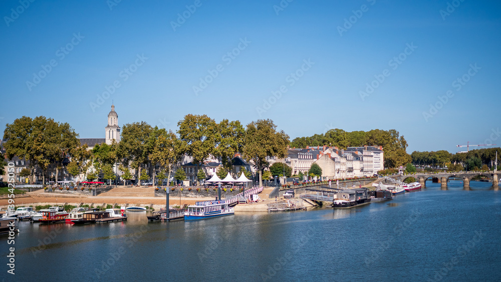 Cityscape of Angers, a city located in western France. View on the Maine river. Sunny day, blue sky.