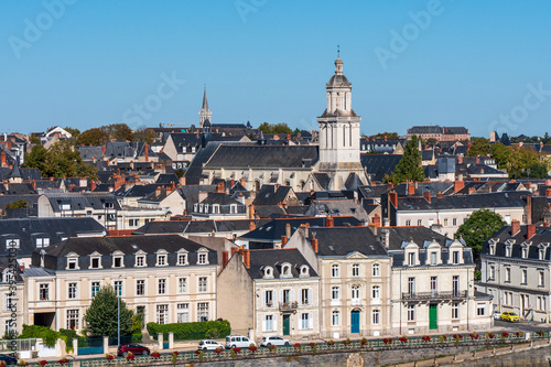 Cityscape of Angers. View on the quays and a church. Blue sky, sunny day. Angers is a city located in western France, in the maine-et-loire department. Summer.