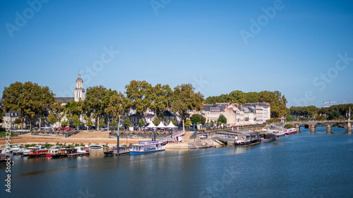 Cityscape of Angers, a city located in western France. View on the Maine river. Sunny day, blue sky.