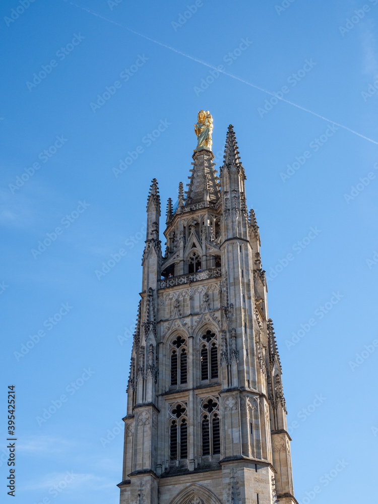 The Tour Pey-Berland (Pey Berland Tower) is the separate bell tower of the Bordeaux Cathedral, in Bordeaux at the Place Pey Berland. Bordeaux is a city located in the southwest of France. Blue sky.