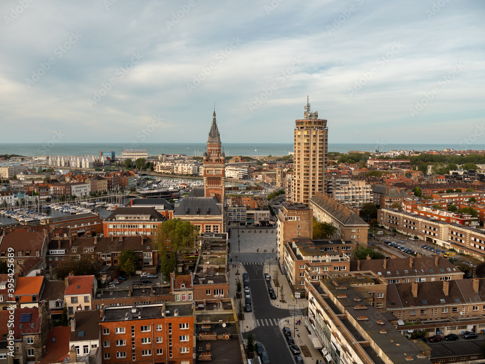 Cityscape of Dunkirk. View on the city and the town hall from the St Eloi belfry. Some clouds in the sky. 