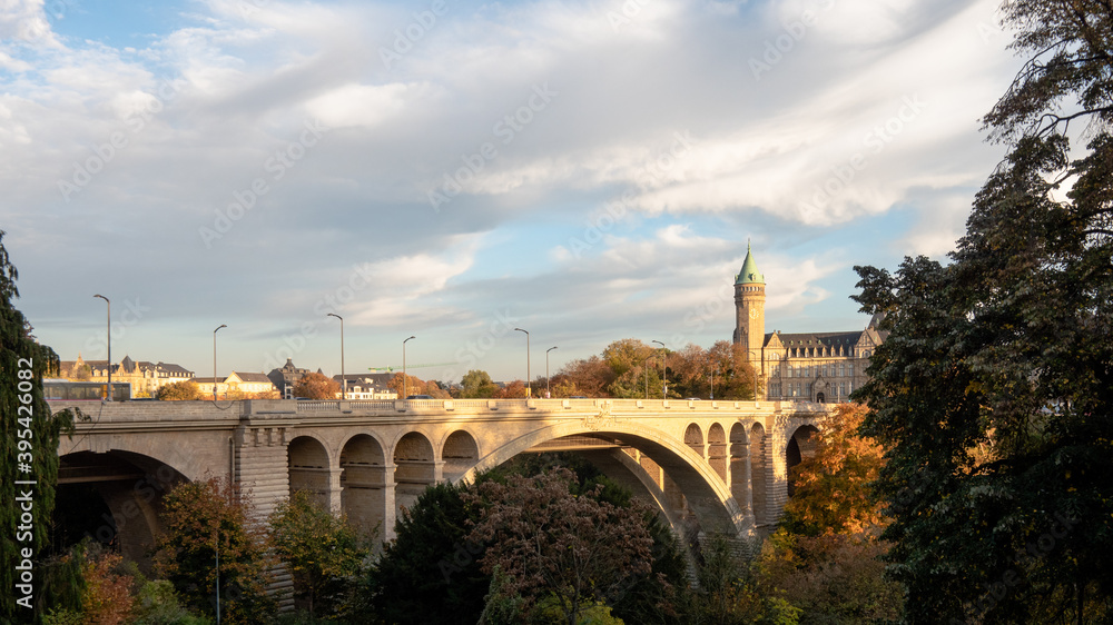 The Adolphe Bridge is a double-decked arch bridge in Luxembourg City, in southern Luxembourg, in Europe. Photographed during autumn. Cloudy sky. 