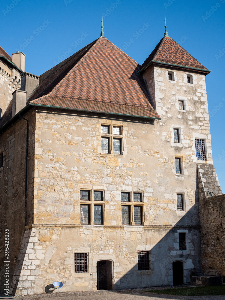 View on the Château d'Annecy (Annecy castle), a restored castle which dominates the old French town of Annecy in the Haute-Savoie département. Sunny day and blue sky.
