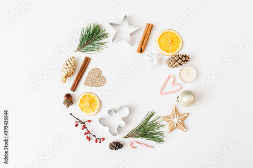 Trendy creative Christmas, winter, new year composition. Fir tree branches, Christmas decorations on white background. Flat lay, top view, copy space