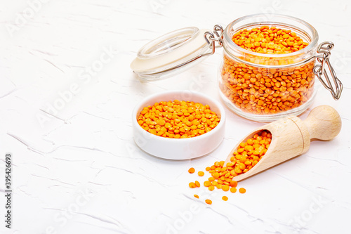 Dry orange lentils in glass jar