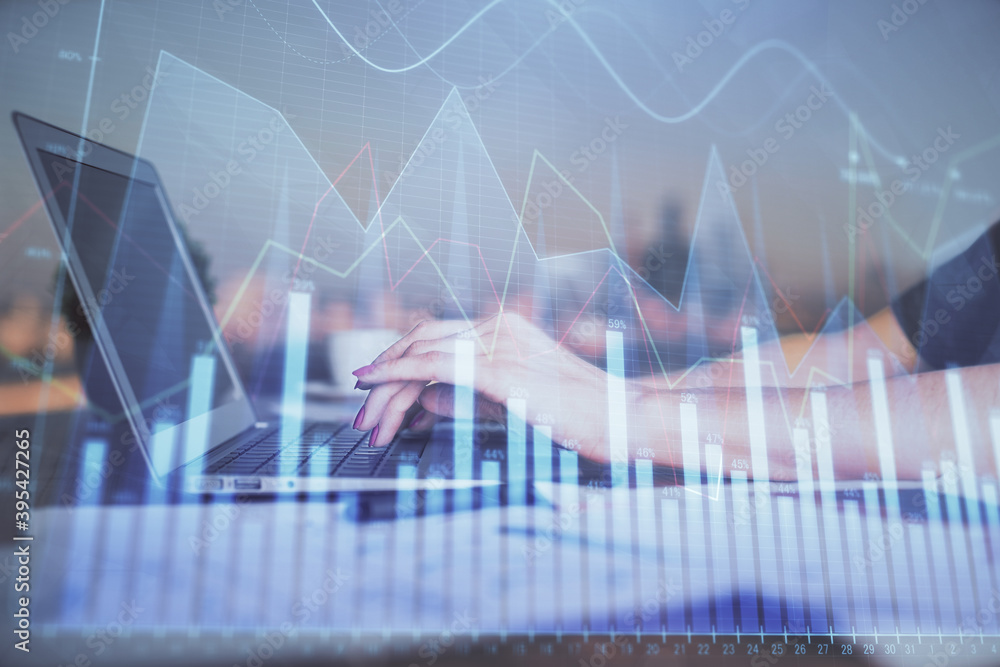 Double exposure of businesswoman hands typing on computer and forex chart hologram drawing. Financial analysis concept. Double exposure of businesswoman hands typing on computer and forex chart hologram drawing. Financial analysis concept.