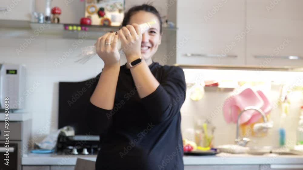 Slow motion: Dancing cheerful woman prepares an healthy cake at home and has fun. Blogger assembling a cake at home Slow motion: Dancing cheerful woman prepares an healthy cake at home and has fun. Blogger assembling a cake at home