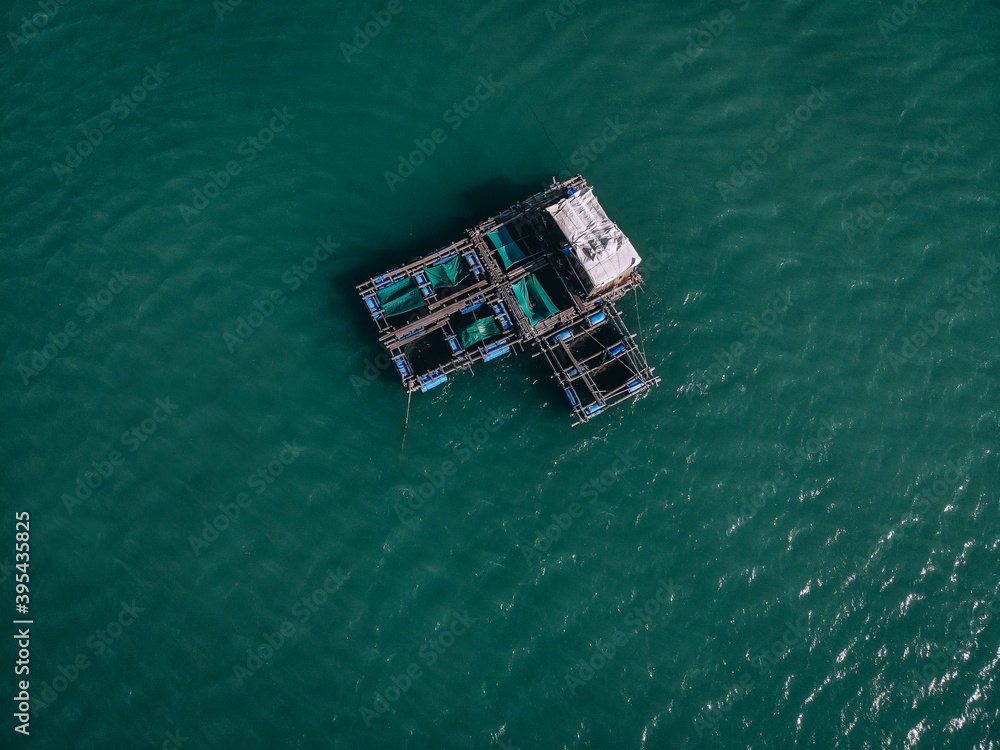 Aerial drone top view photo of large fishing boat cruising with  fishing net to catch fish