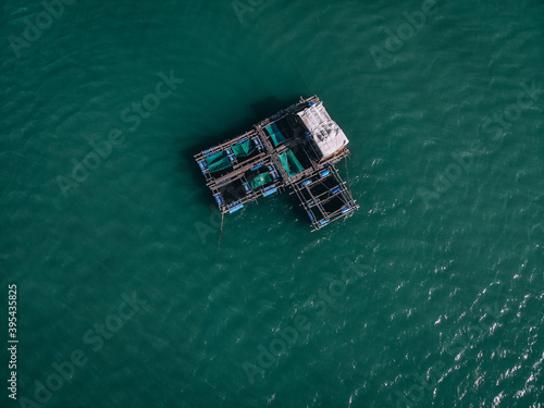 Aerial drone top view photo of large fishing boat cruising with fishing net to catch fish