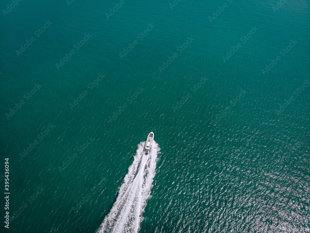 speed Boat/ yacht at sea leaving a wake, aerial view