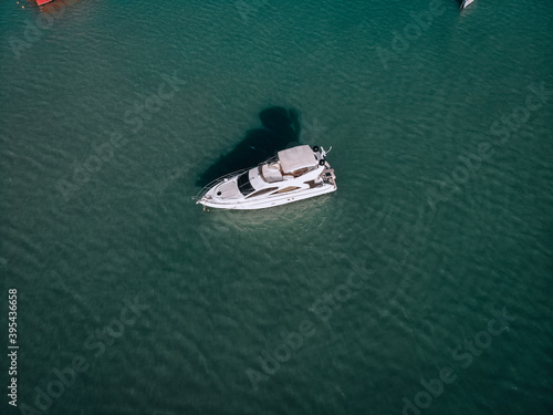 Aerial photo of an isolated luxury white  yacht design in the sea © Semachkovsky 