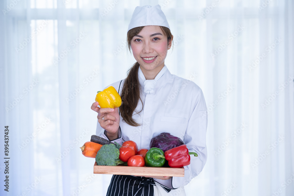 Beautiful chef with beautiful vegetables. Female Chef preparing food, Many fresh vegetables for cooking. Beautiful chef with beautiful vegetables. Female Chef preparing food, Many fresh vegetables for cooking.