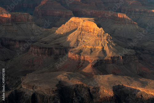 close up of setting sun shining on part of the grand canyon national park from hopi point in arizona