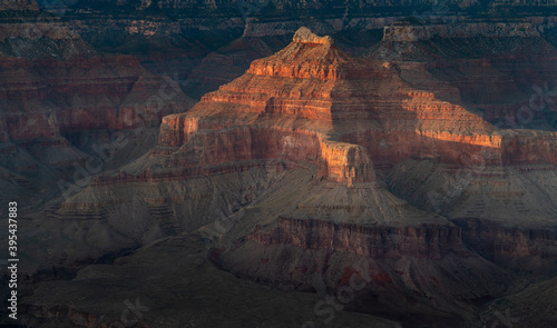 close up of setting sun shining on walls of the grand canyon national park from hopi point in arizona