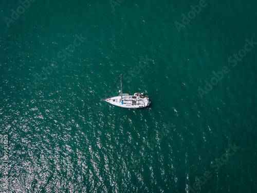 Aerial view of a  sailing yacht in the turquoise water of the Andaman sea. Phuket. Thailand © Semachkovsky 
