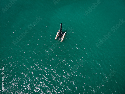 aerial View Of little yacht with black sail At The Andaman sea. Phuket. Thailand