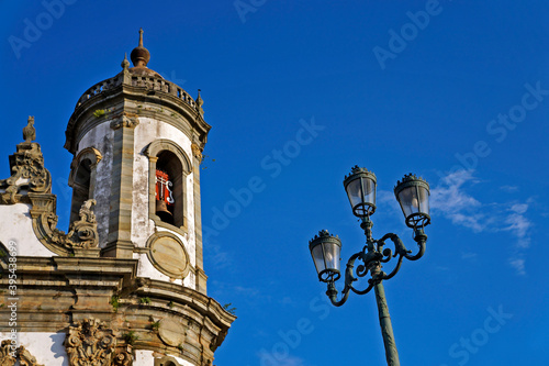 Ancient light pole and baroque church, Sao Joao del Rei, Brazil