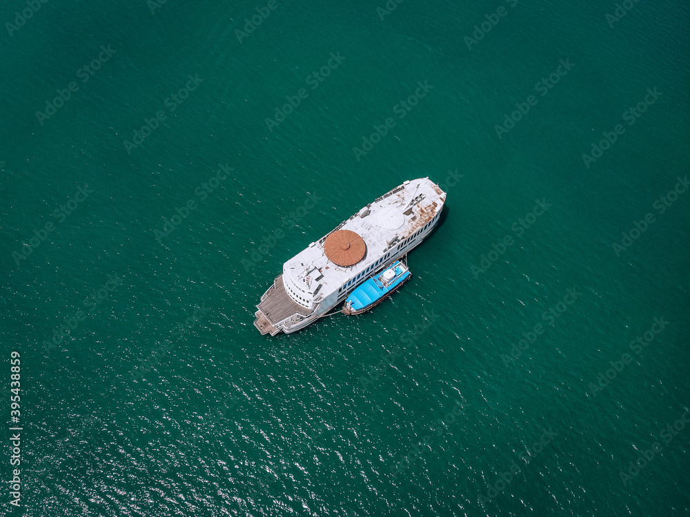 Aerial drone top view photo of luxury yacht with blue boat. Phuket. Thailand. Aerial drone top view photo of luxury yacht with blue boat. Phuket. Thailand.