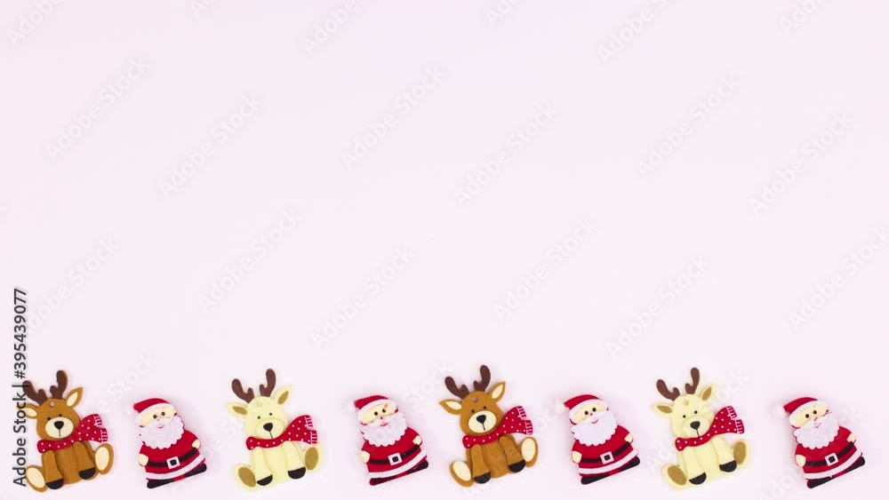 Christmas Santa Clouse and reindeers move on bottom of white theme. Stop motion Christmas Santa Clouse and reindeers move on bottom of white theme. Stop motion