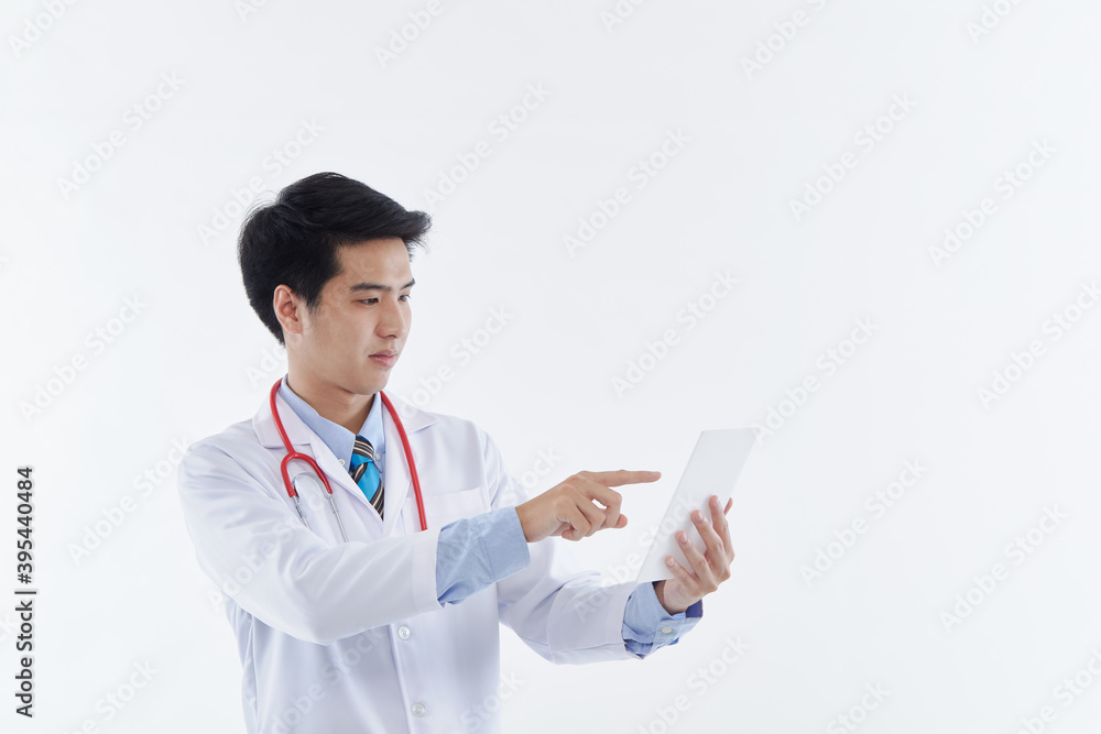 Asian man doctor using a tablet computer