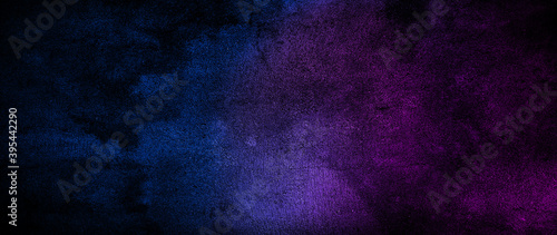 Dark blue and purple concrete textured background.