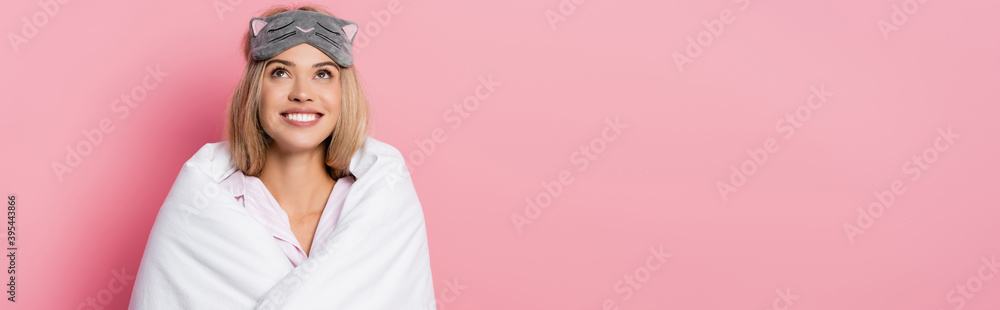 woman in blindfold and blanket looking up on pink background, banner woman in blindfold and blanket looking up on pink background, banner