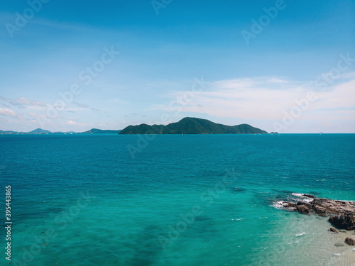 Top view aerial photo from flying drone of an amazing seascape with paradise beach and sea with turquoise water. Summer vacation holidays in Thailand. Perfect website background with copy space area