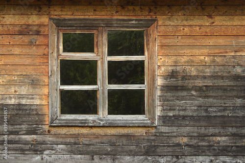 Aged Wooden wall with window Close up. Wall background.
