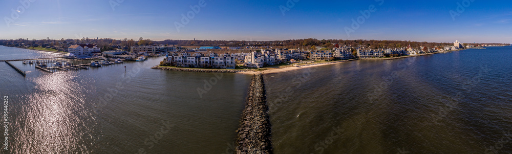 Aerial view of Chesapeake Beach marina with luxury sail boats, beach house apartments, fishing boats near the water park popular vacation spot for Washington residents in Calvery county Maryland