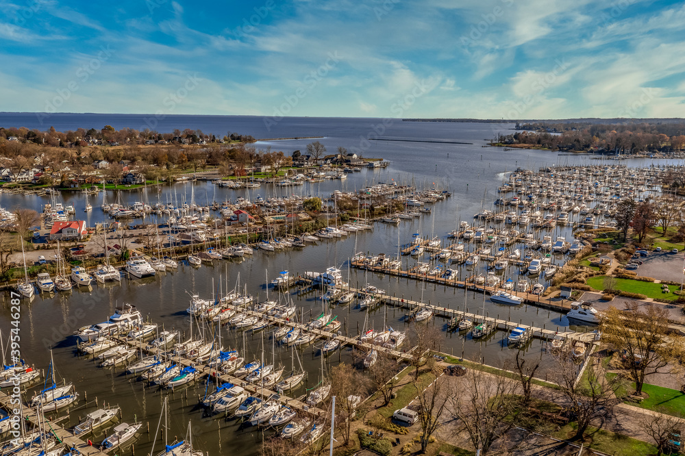 Scenic aerial panorama of Deale  waterfront docks on the Western Shore of Chesapeake Bay Maryland, dozens of luxury sailboats docking in the marina.  
